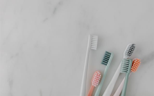 Toothbrushes on a marble counter